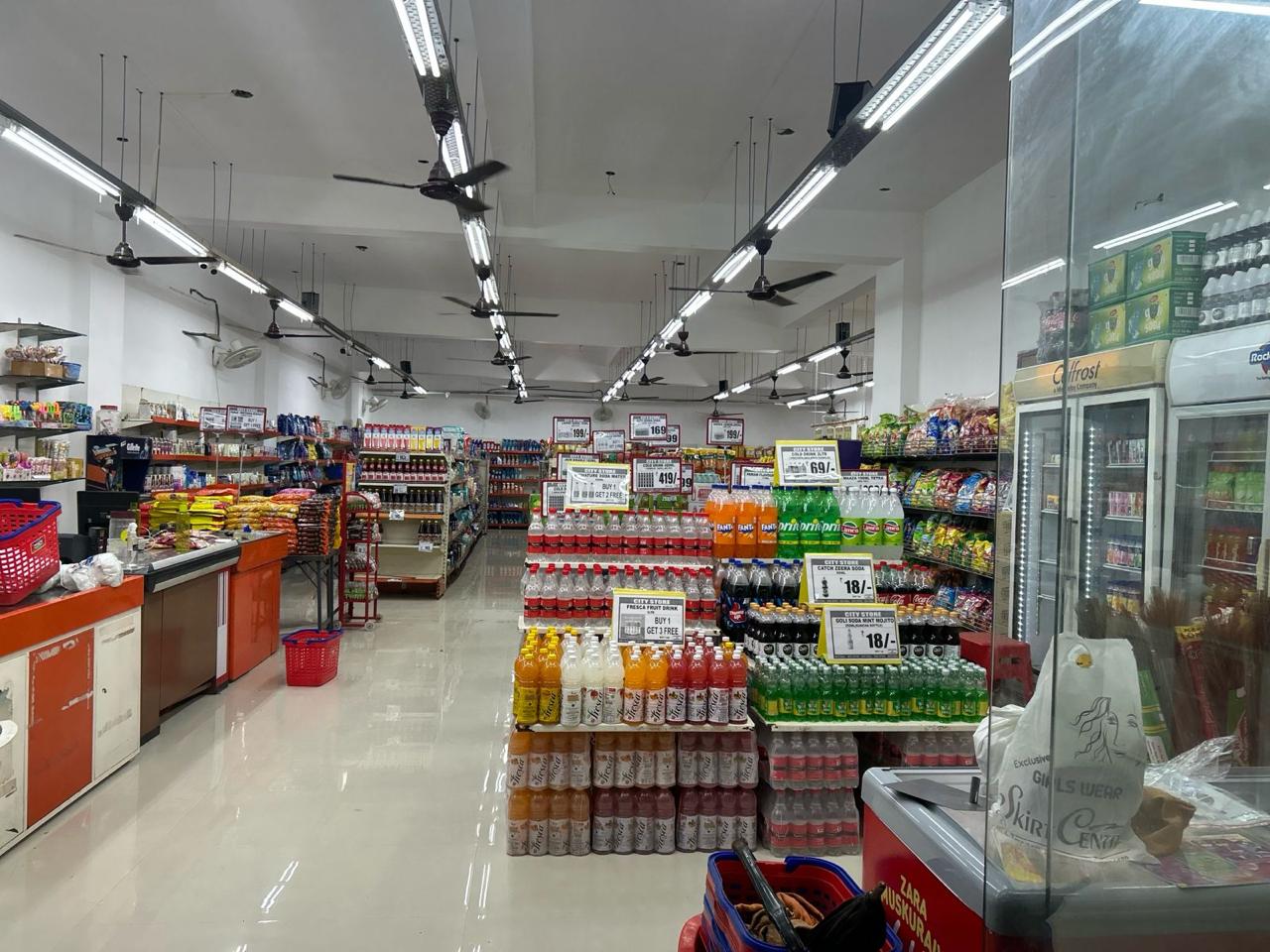 Beverage shelves and checkout counter inside the store